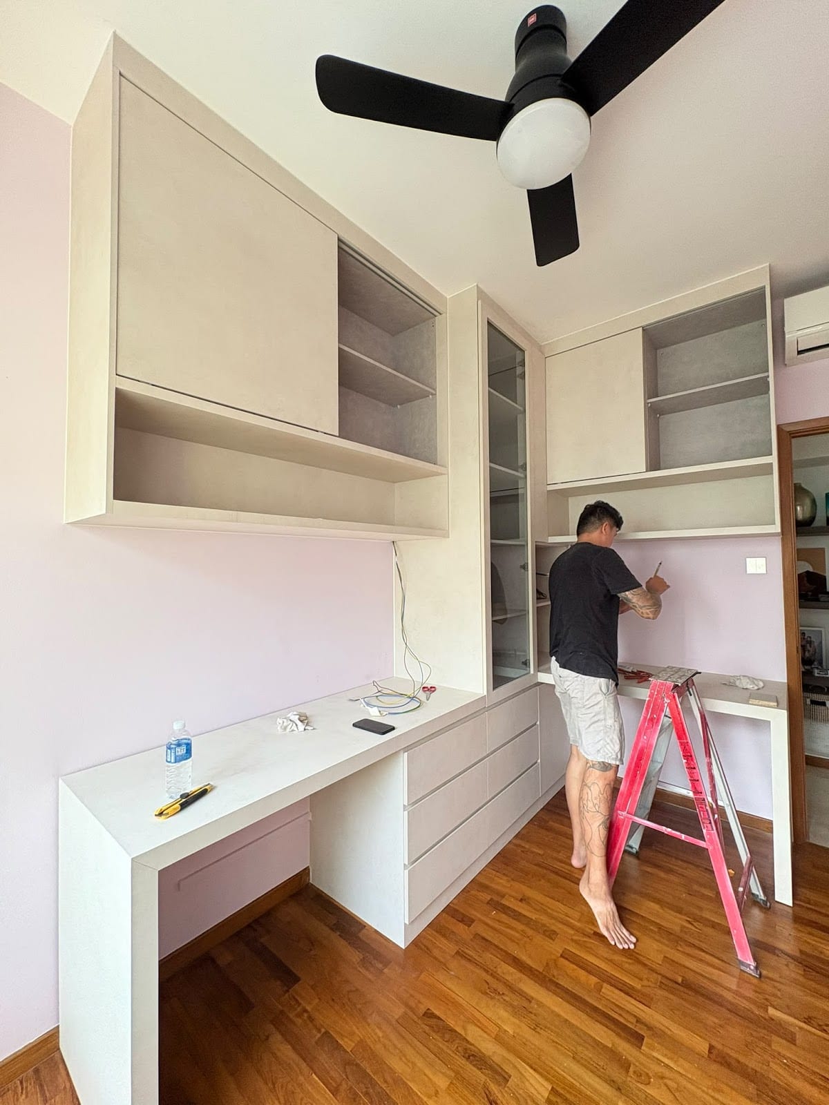 Bathroom tiling overhaul with non-slip floor tiles and black sanitary fittings in Singapore